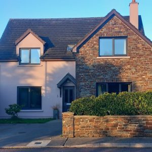 Modern dark rose exterior paint paired with original brickwork