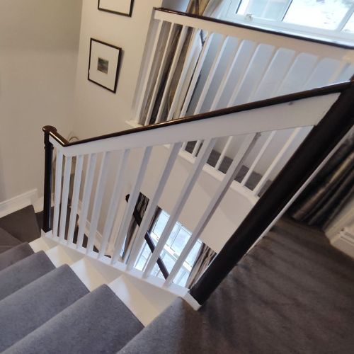 White banisters with brown handrail